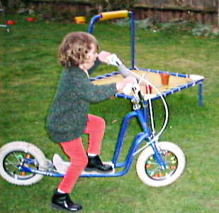Alice riding our scooter